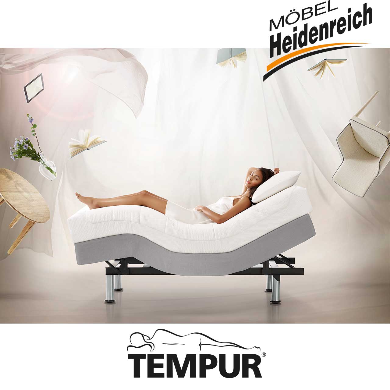 Grauer Bett-Unterbau mit Haltebügel für Matratze in gebogener Position mit darauf liegender Person.
